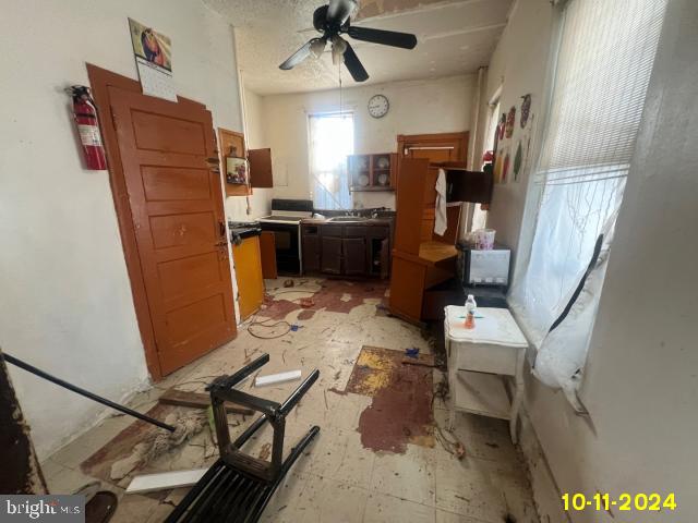 5426 Trinity St, Philadelphia, PA 19143 - kitchen featuring range with electric stovetop, a sink, and ceiling fan