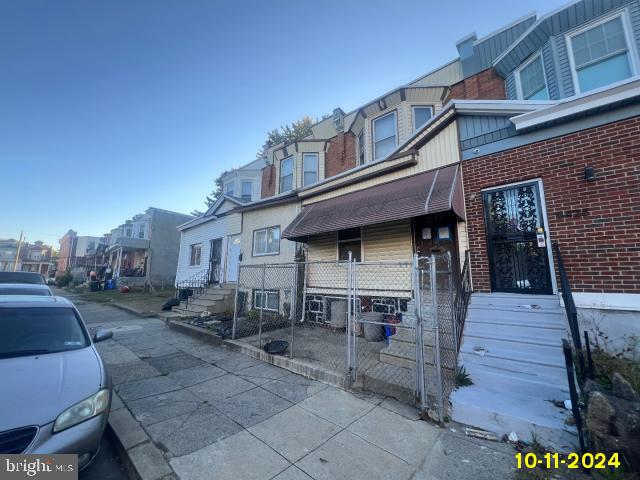 5426 Trinity St, Philadelphia, PA 19143 - view of front of home featuring brick siding and a residential view