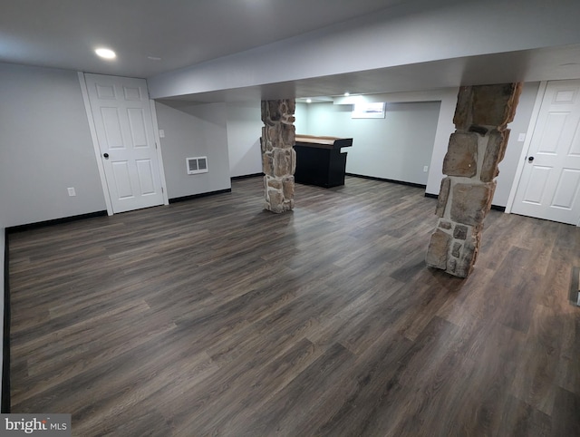 basement featuring dark hardwood / wood-style floors