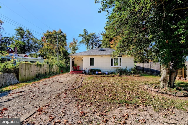 rear view of property with fence
