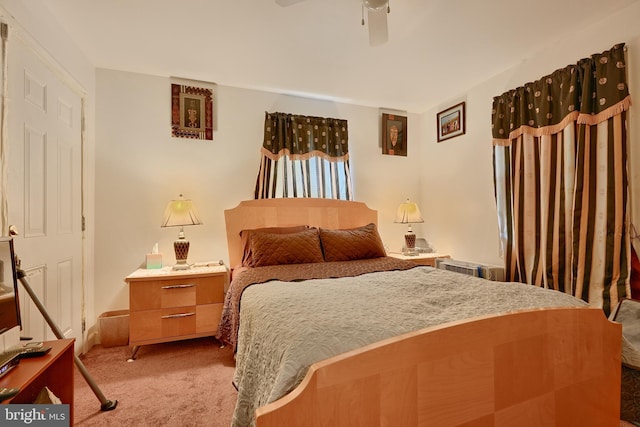 bedroom with light colored carpet and ceiling fan