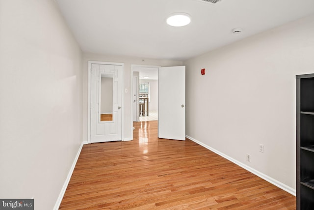 unfurnished room featuring light hardwood / wood-style floors