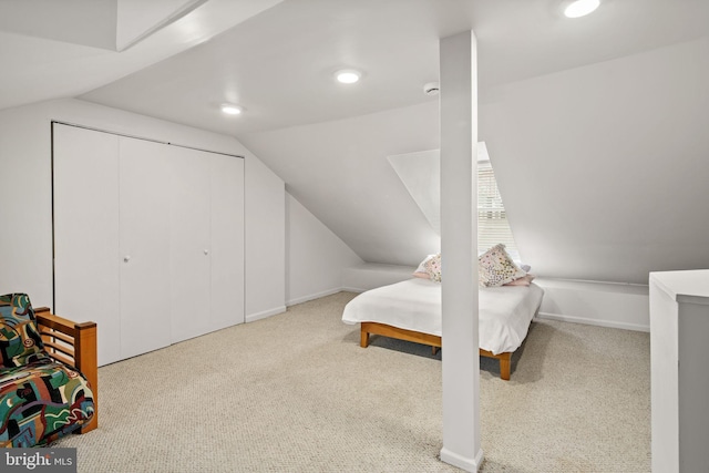 carpeted bedroom featuring vaulted ceiling