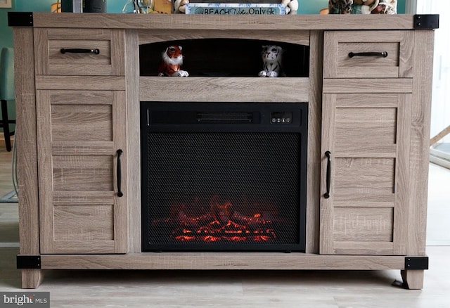 interior details featuring a fireplace and hardwood / wood-style flooring