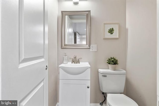 bathroom with toilet and vanity