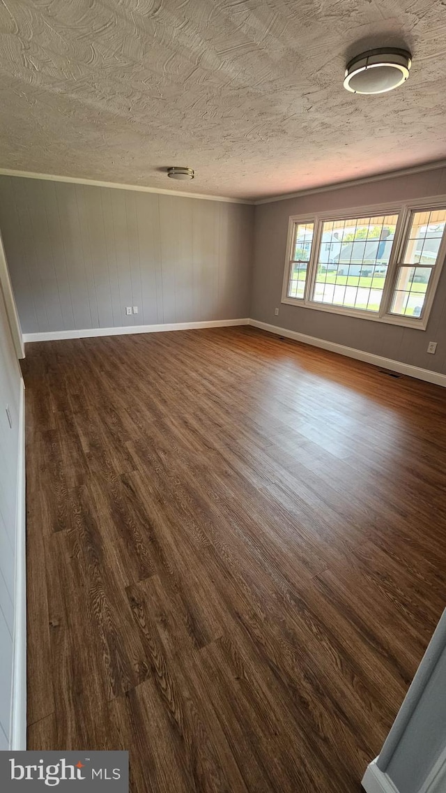 spare room featuring dark hardwood / wood-style flooring