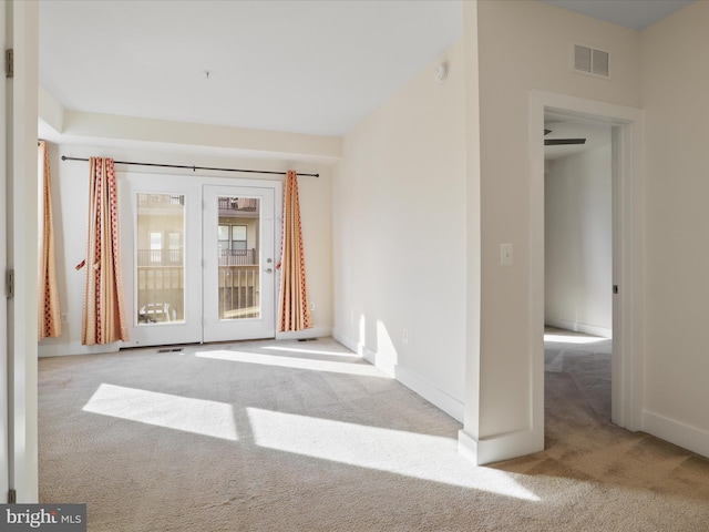 carpeted empty room with ceiling fan