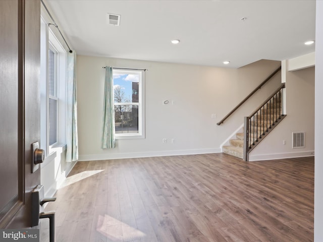 unfurnished room with light wood-type flooring