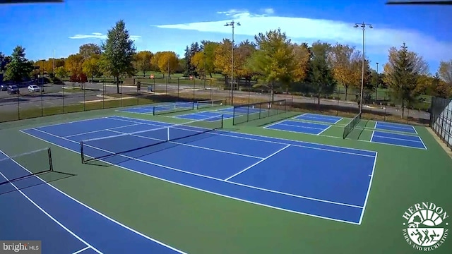 view of sport court featuring basketball hoop