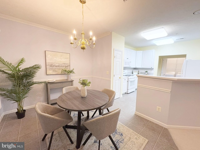 dining space featuring ornamental molding, a chandelier, and light tile patterned floors