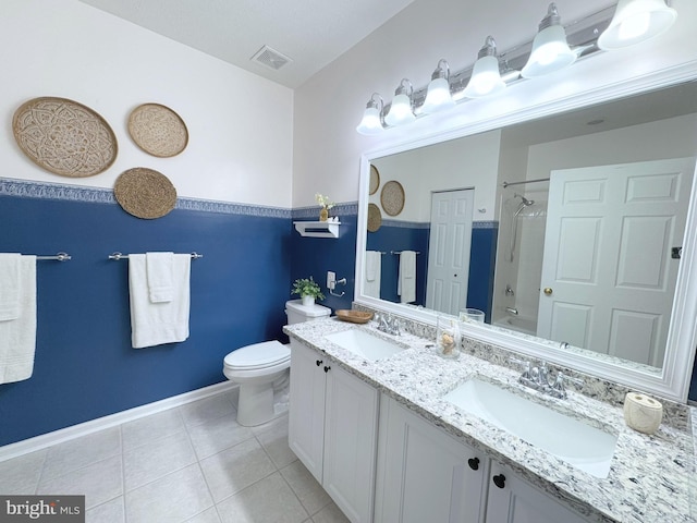 full bathroom with vanity, tile patterned floors, shower / washtub combination, and toilet