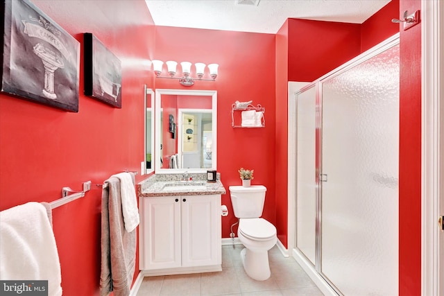 bathroom with walk in shower, vanity, toilet, and tile patterned flooring