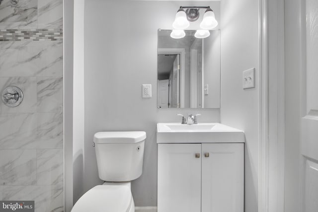 full bath with toilet, walk in shower, and vanity