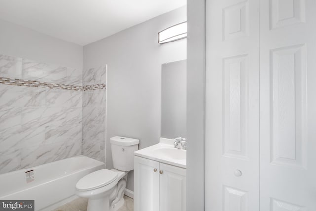 full bathroom with vanity, tiled shower / bath combo, and toilet