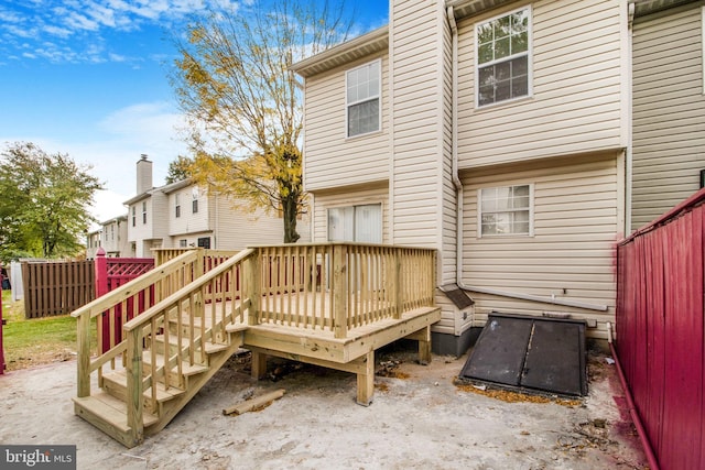 back of house featuring a wooden deck