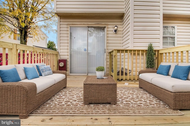 wooden terrace featuring outdoor lounge area