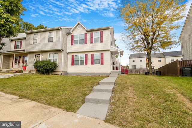 view of property featuring a front lawn