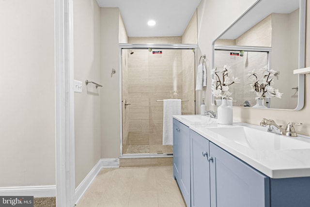 bathroom featuring vanity, tile patterned floors, and an enclosed shower