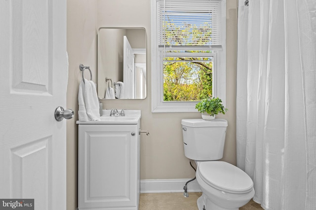 bathroom featuring toilet and vanity