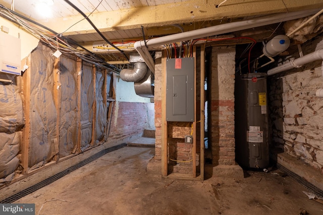 basement with electric water heater and electric panel