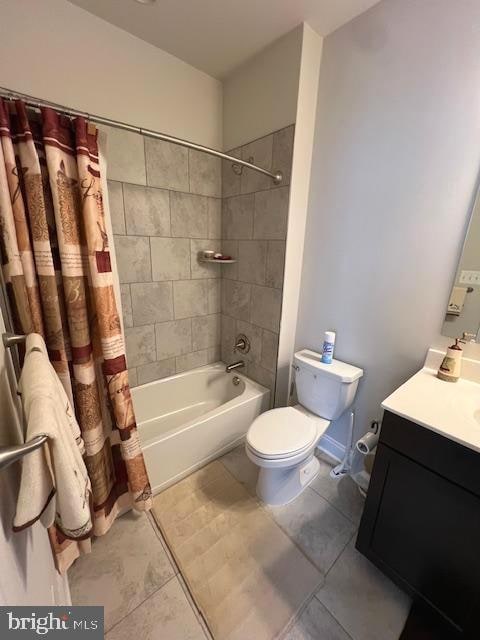 full bathroom with vanity, toilet, shower / bath combo, and tile patterned flooring