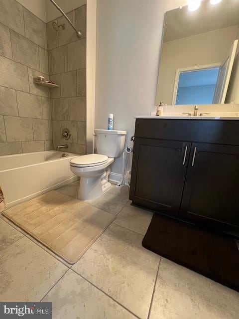 full bathroom with vanity, tiled shower / bath combo, toilet, and tile patterned floors