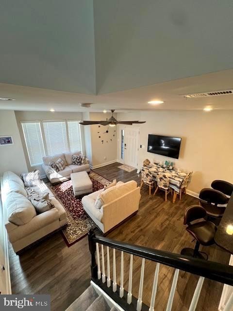 living room with ceiling fan and hardwood / wood-style flooring