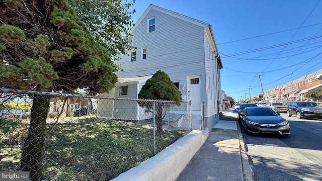 view of property exterior with a yard