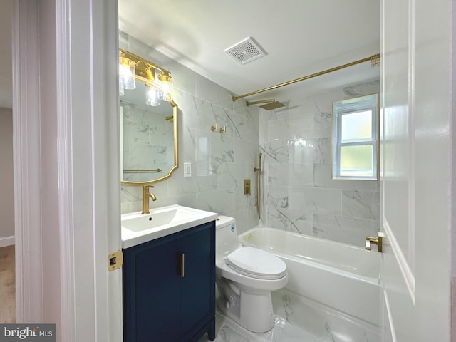 full bathroom with vanity, toilet, and tiled shower / bath