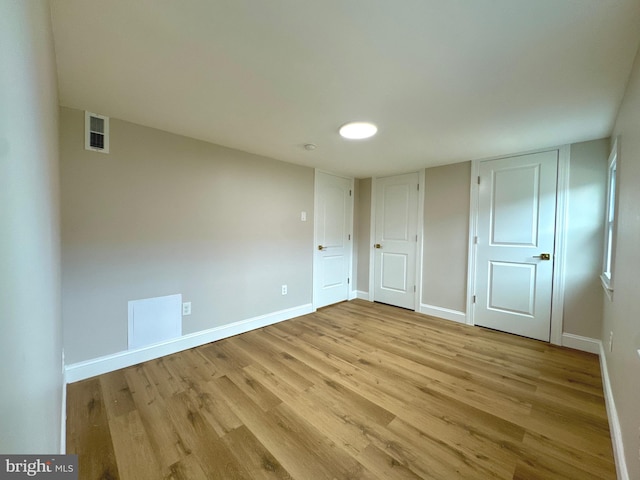 unfurnished bedroom featuring light wood-type flooring