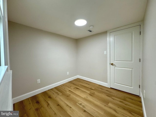 spare room featuring light hardwood / wood-style floors