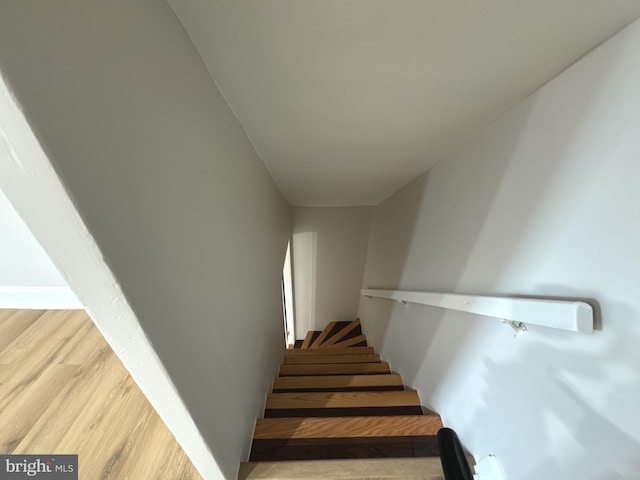 stairway featuring hardwood / wood-style flooring