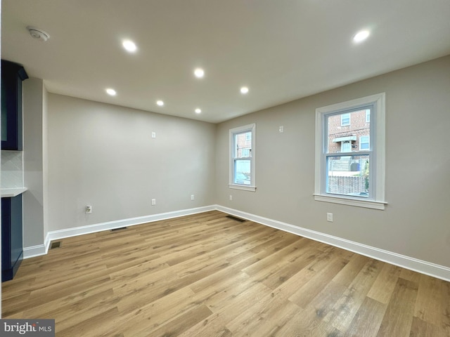 unfurnished room with plenty of natural light and light wood-type flooring