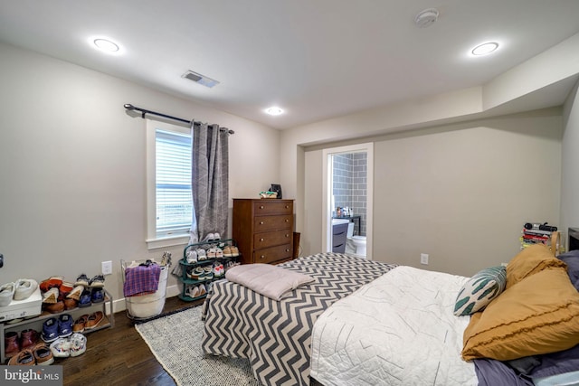 bedroom featuring dark hardwood / wood-style flooring