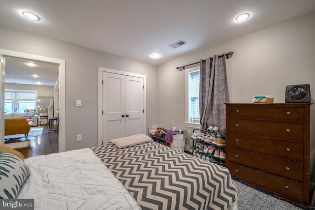 bedroom featuring a closet and hardwood / wood-style flooring