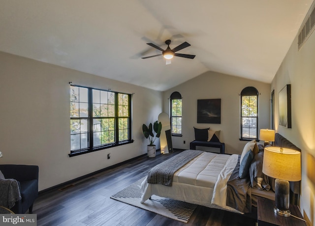 bedroom featuring ceiling fan, vaulted ceiling, and dark hardwood / wood-style flooring