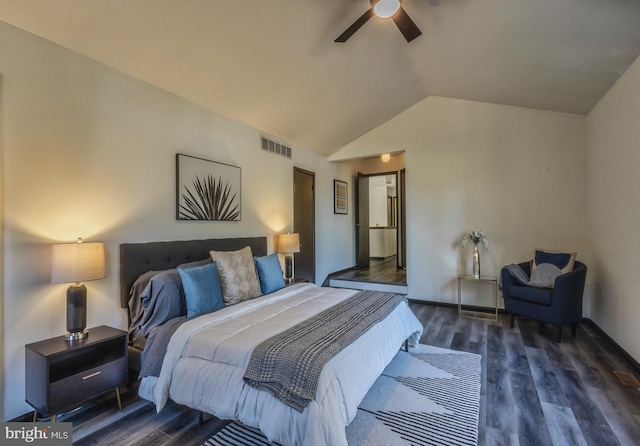 bedroom with lofted ceiling, dark wood-type flooring, and ceiling fan