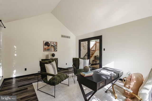 office area with hardwood / wood-style floors and high vaulted ceiling