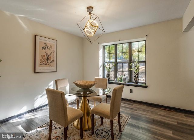 dining room featuring dark hardwood / wood-style flooring