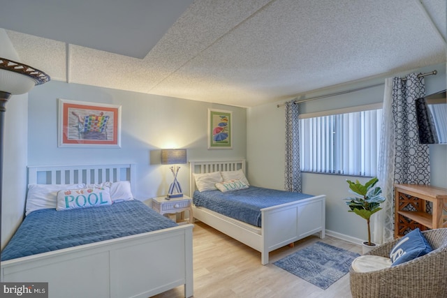 bedroom with light wood-type flooring