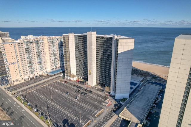 birds eye view of property with a view of the beach and a water view