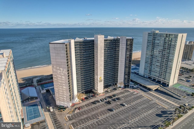 birds eye view of property featuring a water view and a view of the beach