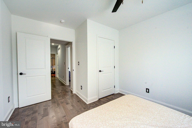 bedroom featuring dark hardwood / wood-style floors and ceiling fan