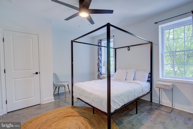 bedroom featuring hardwood / wood-style floors and ceiling fan