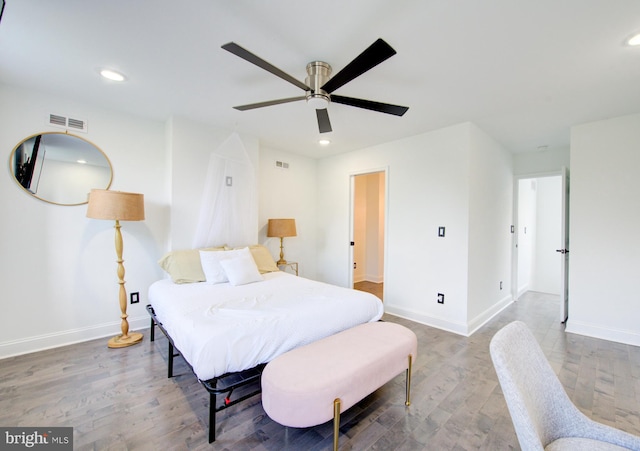 bedroom with hardwood / wood-style flooring and ceiling fan