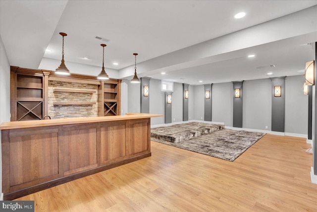 bar with recessed lighting, baseboards, pendant lighting, and light wood-style flooring