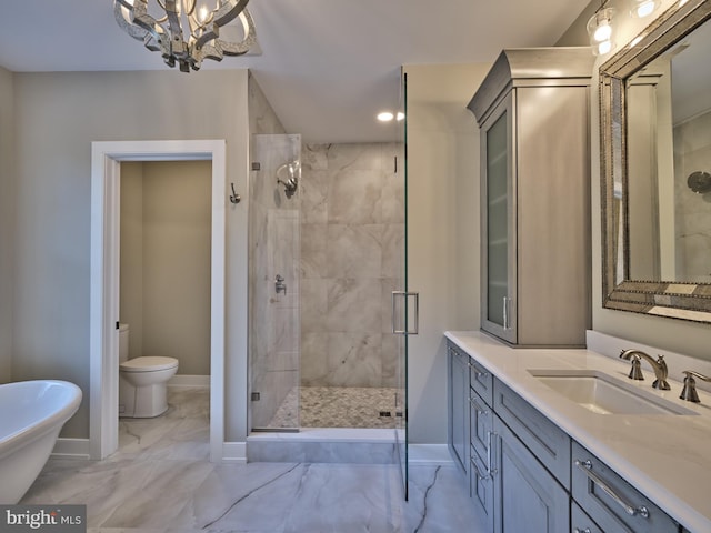 full bath featuring a shower stall, vanity, marble finish floor, baseboards, and a notable chandelier