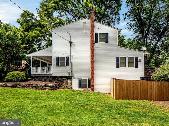 view of property exterior with a yard