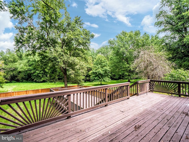 deck featuring a lawn