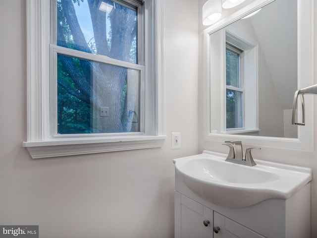 bathroom with vanity and a healthy amount of sunlight